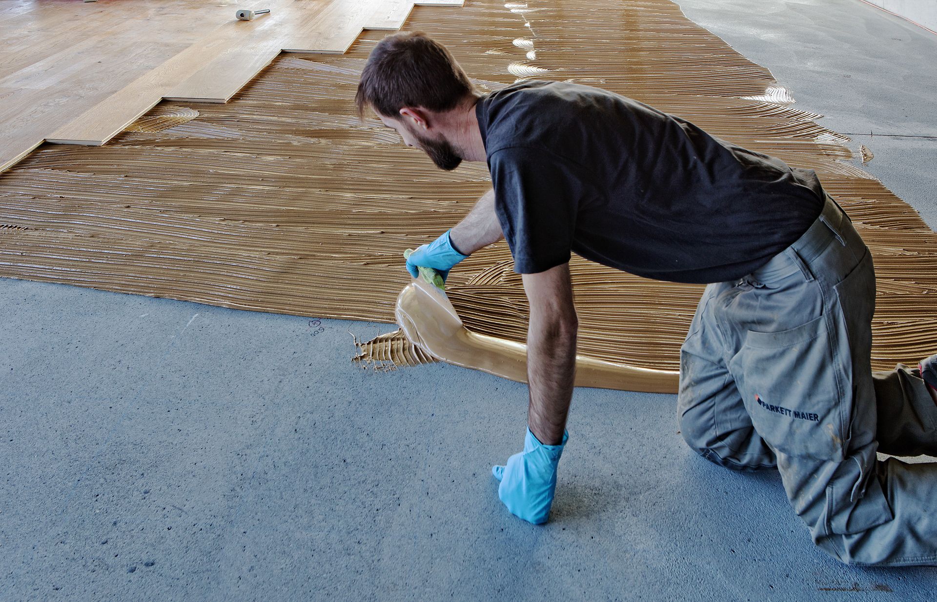 Spreading glue How to glue down carpet 