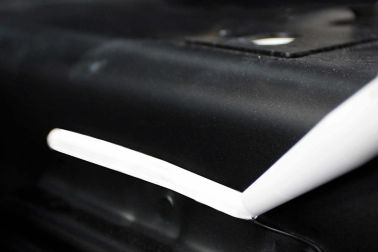 Close up Application of Sikaflex®-AT paint shop repair solution on vehicle 