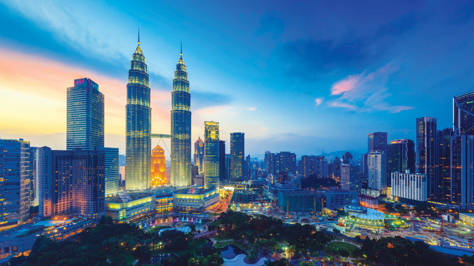 View of Kuala Lumpur skyline with Petronas twin towers at twilight