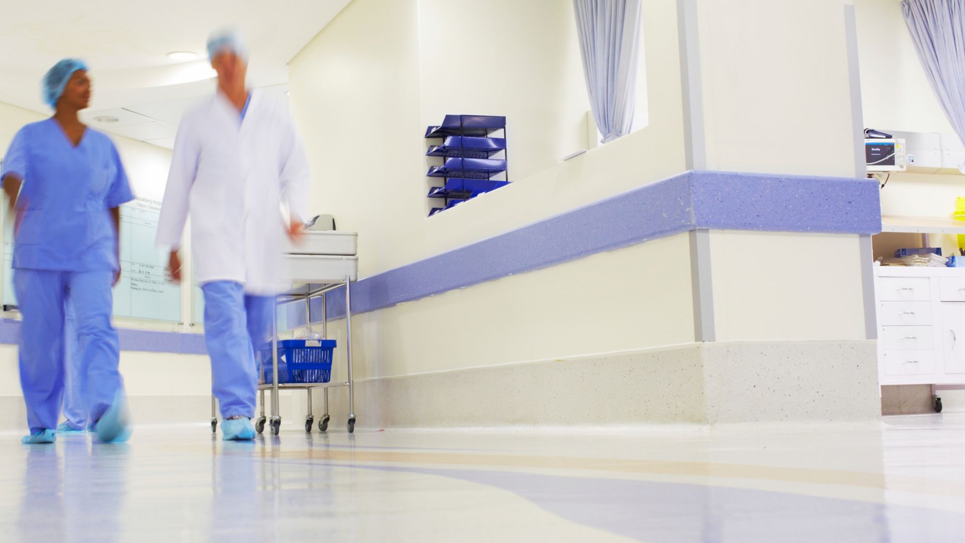 Doctors working in a busy hospital corridor