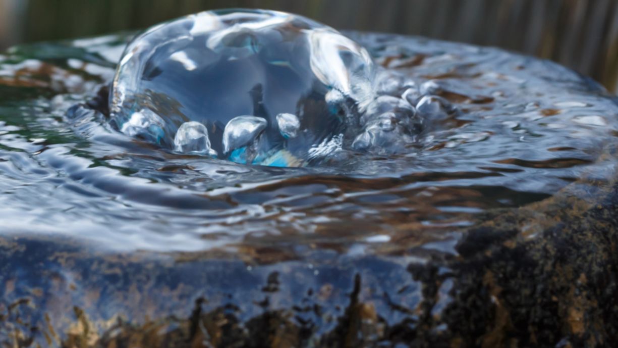 water spill stone fountain closeup detail