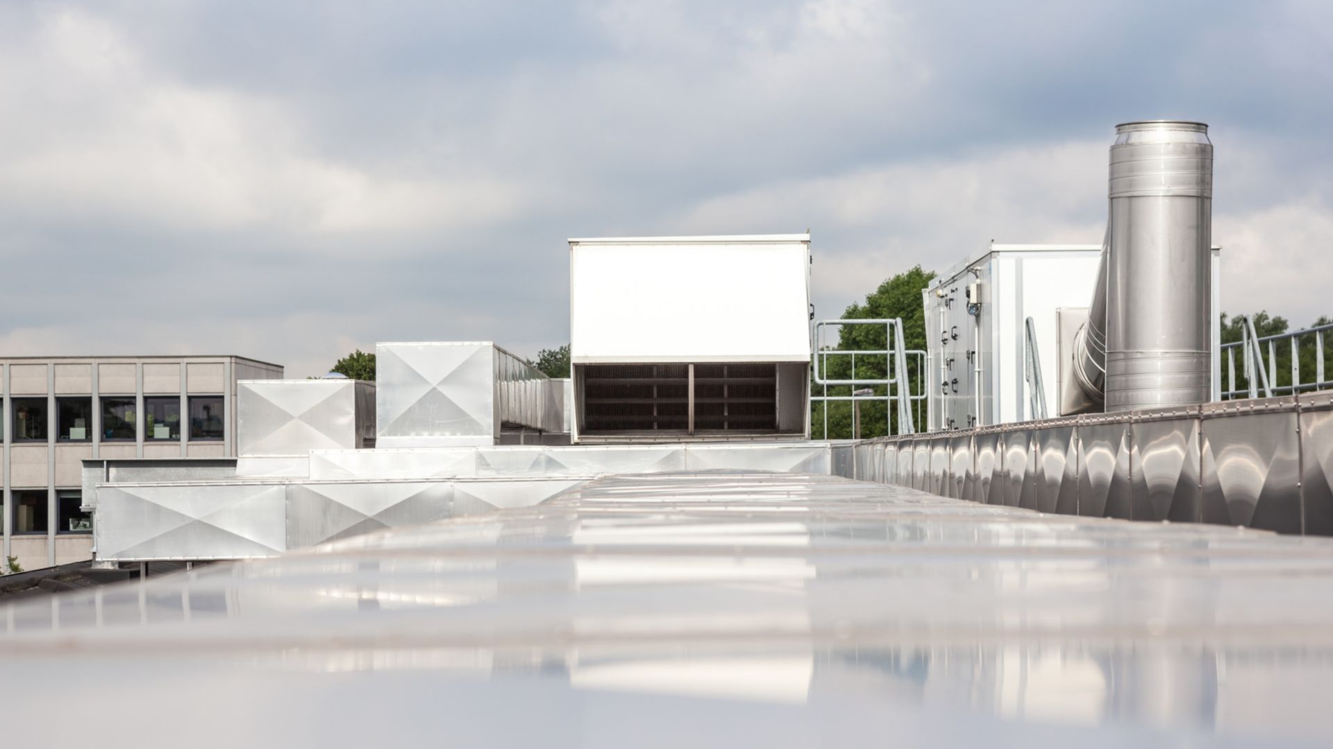 ventilators on the roof of a tall building in the industrial area