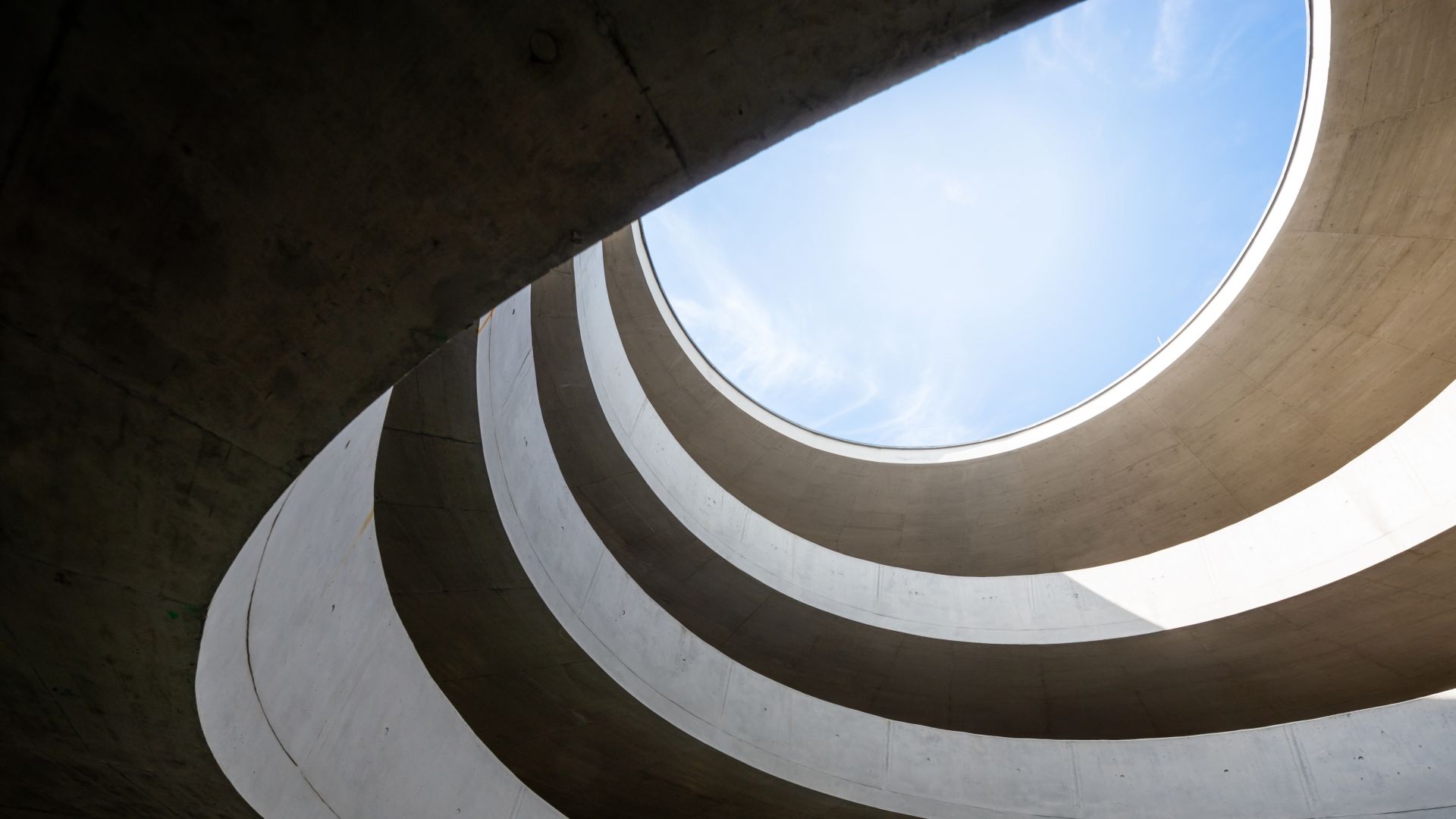 Leipzig, Germany: A modern driveway in a parking garage with a lot of curves.