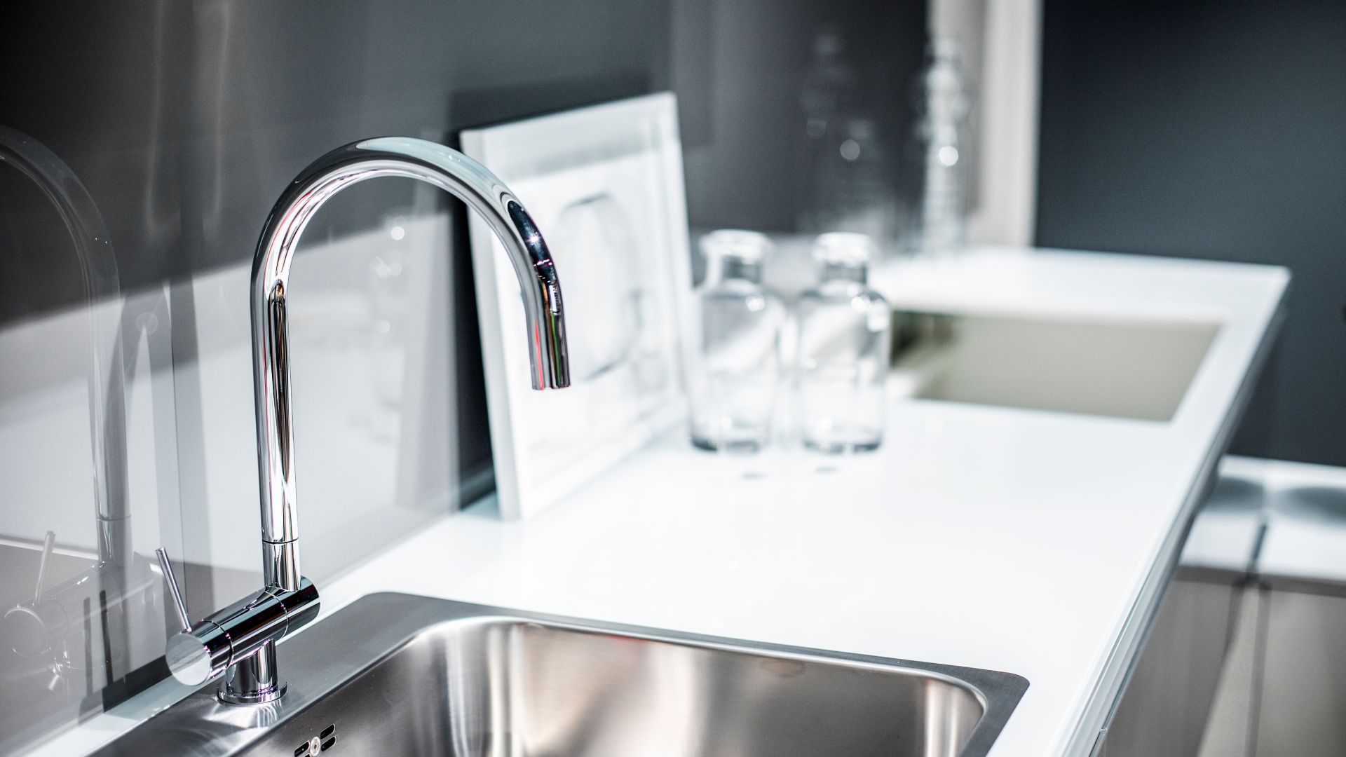 A kitchen food preparation counter with a dishwashing sink.