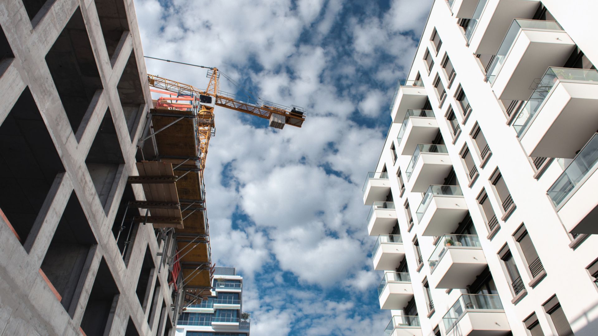 crane among construction site and modern apartment building in Berlin