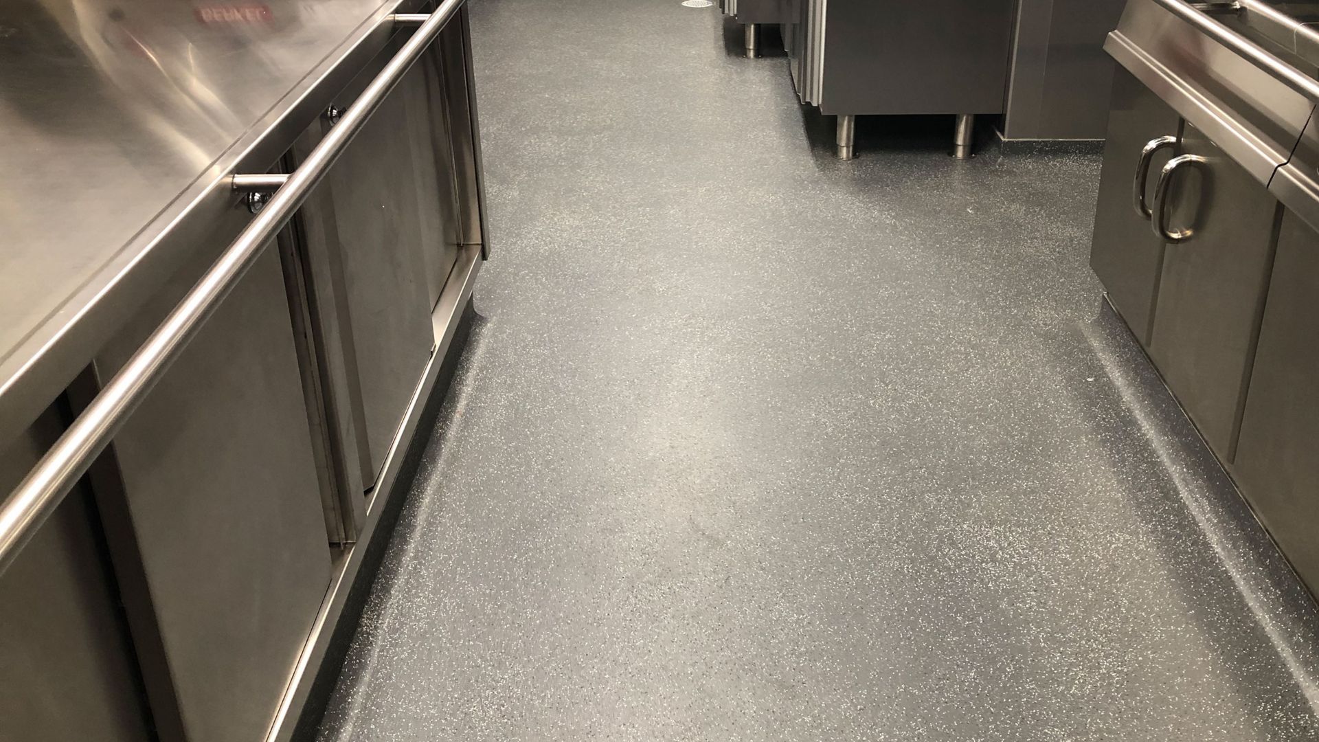 commercial kitchen on a cruise ship with example of a heavy duty flooring system