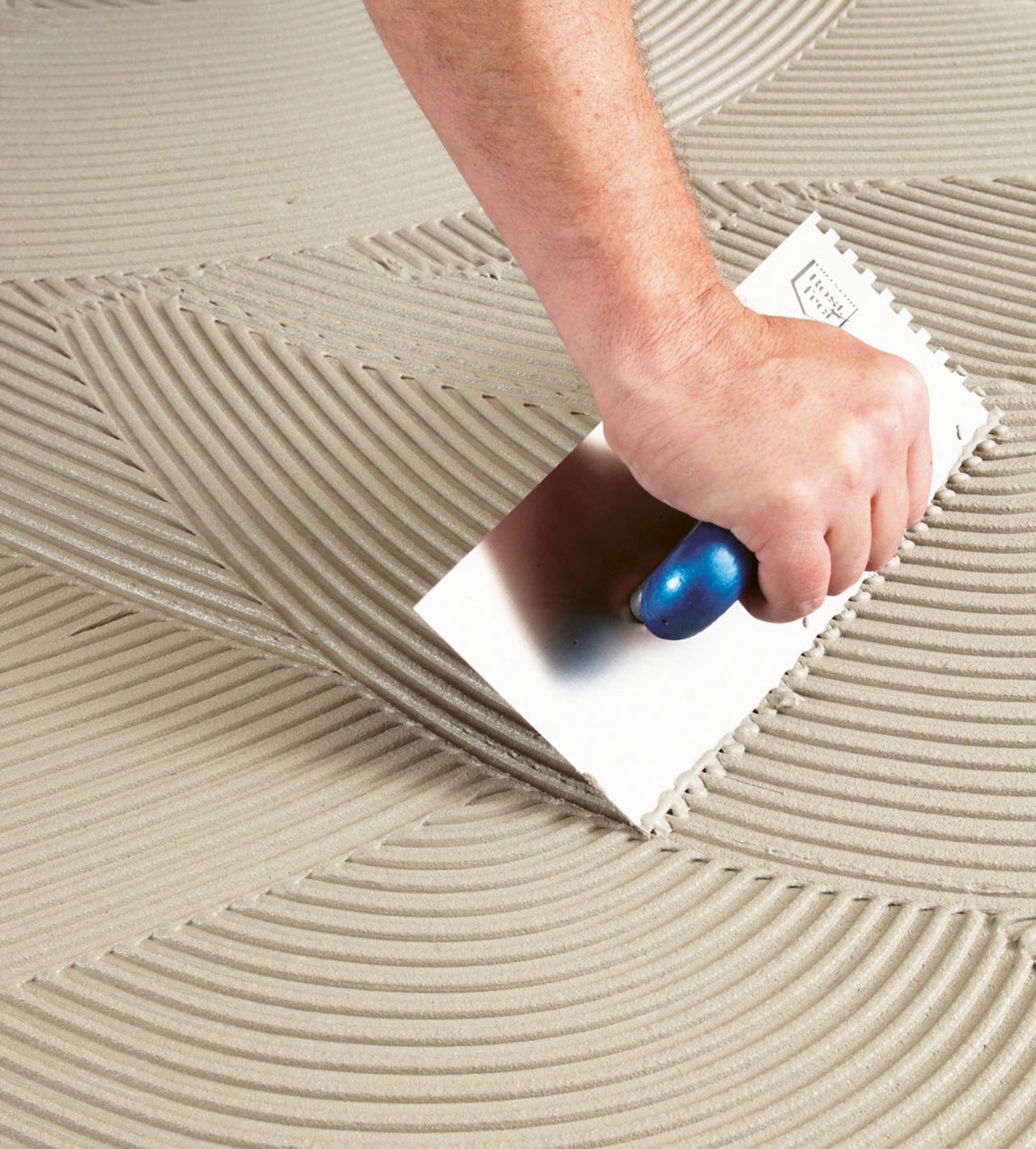 Application of tile adhesives