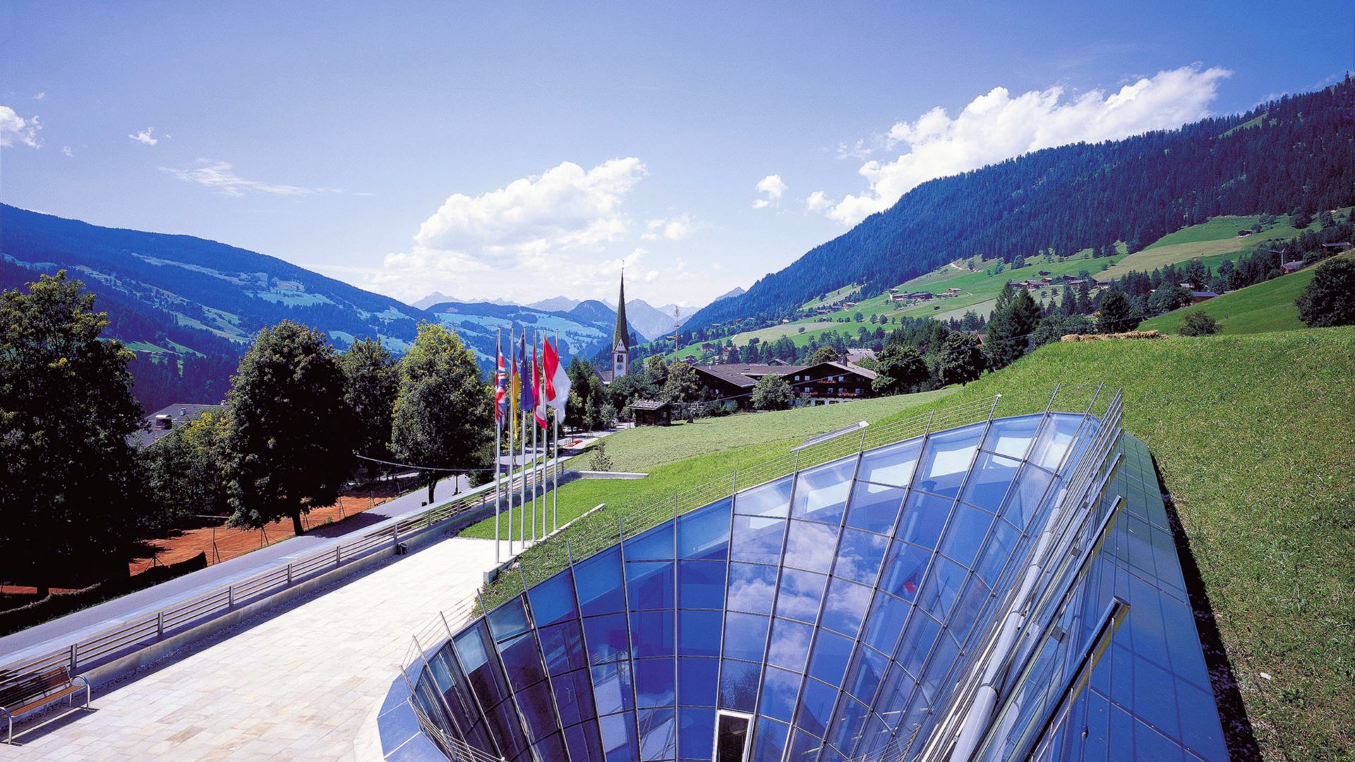 Builiding with green roof in the mountains