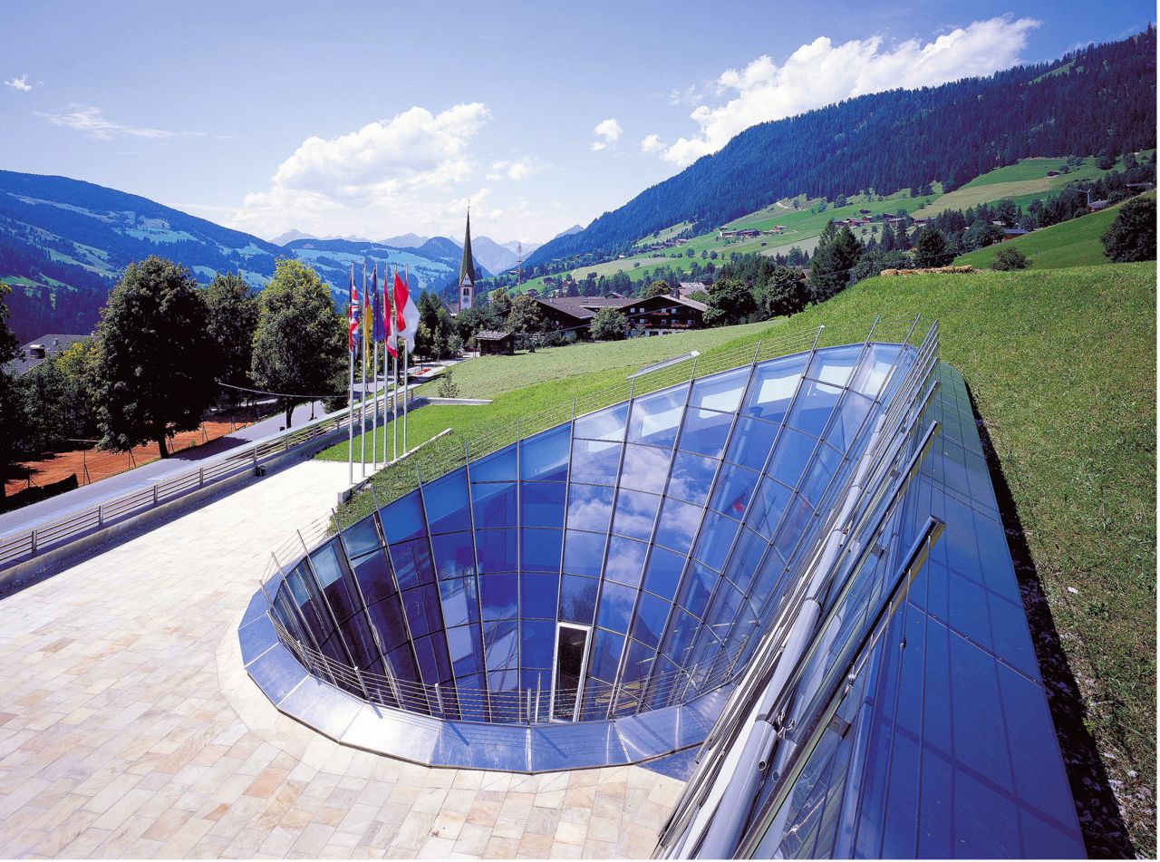 Builiding with green roof in the mountains