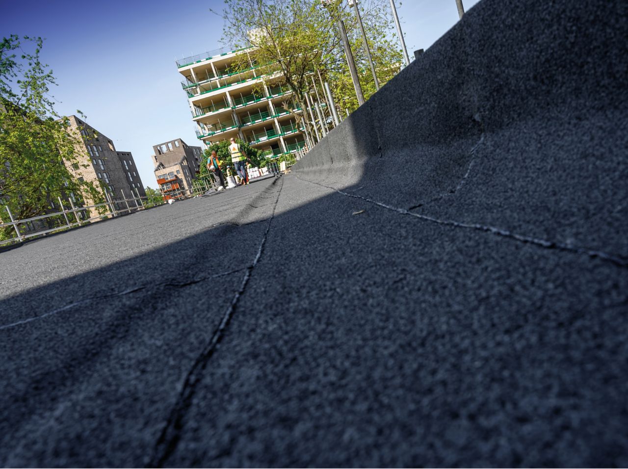 Close up view of bitumen membrane applied on roof at parapet