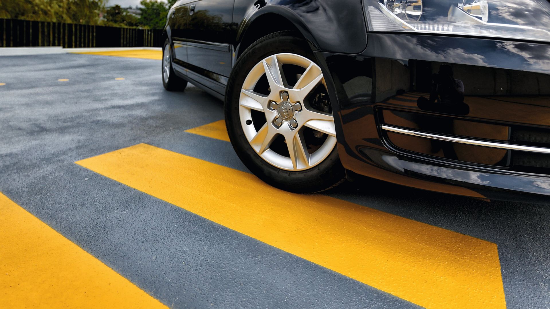 Car on outdoor parking garage made with Sikafloor coating system