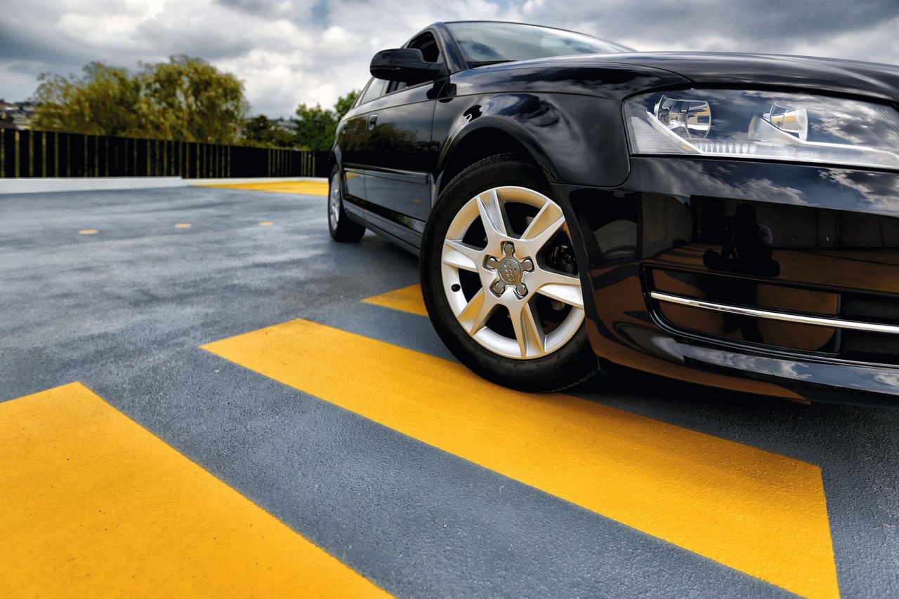 Car on outdoor parking garage made with Sikafloor coating system