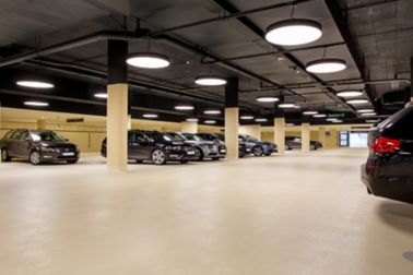 Cars in indoor parking garage made with Sikafloor coating system