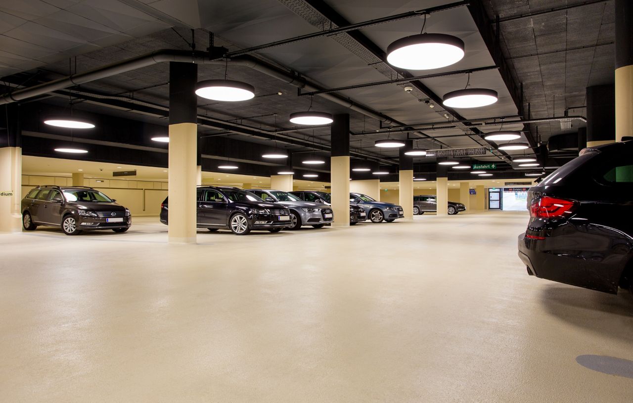 Cars in indoor parking garage made with Sikafloor coating system