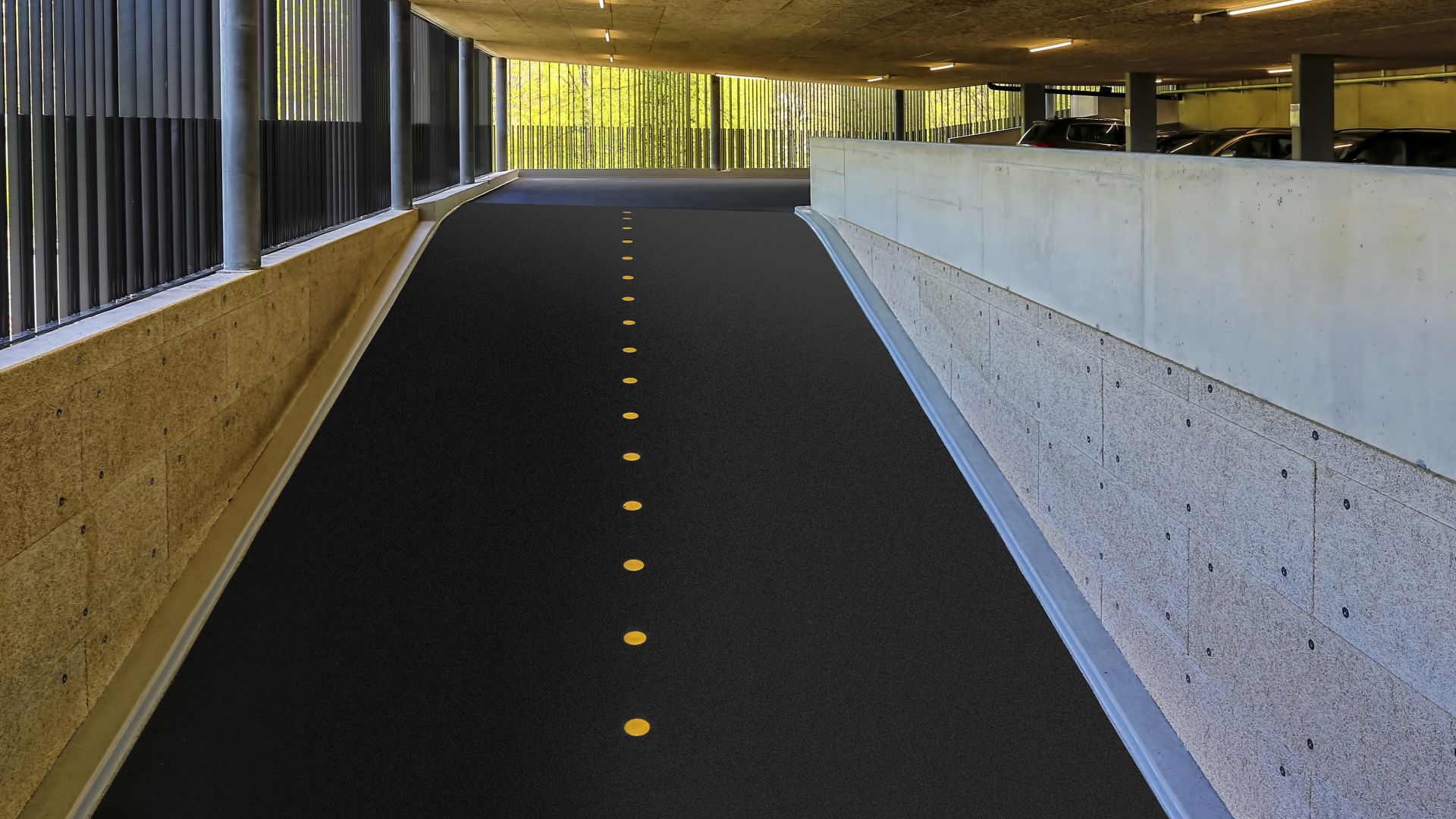 Car park ramp with yellow dot divider in parking garage in Switzerland