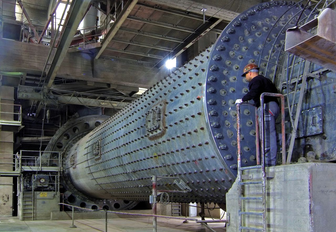 Man at cement mill grinding cement