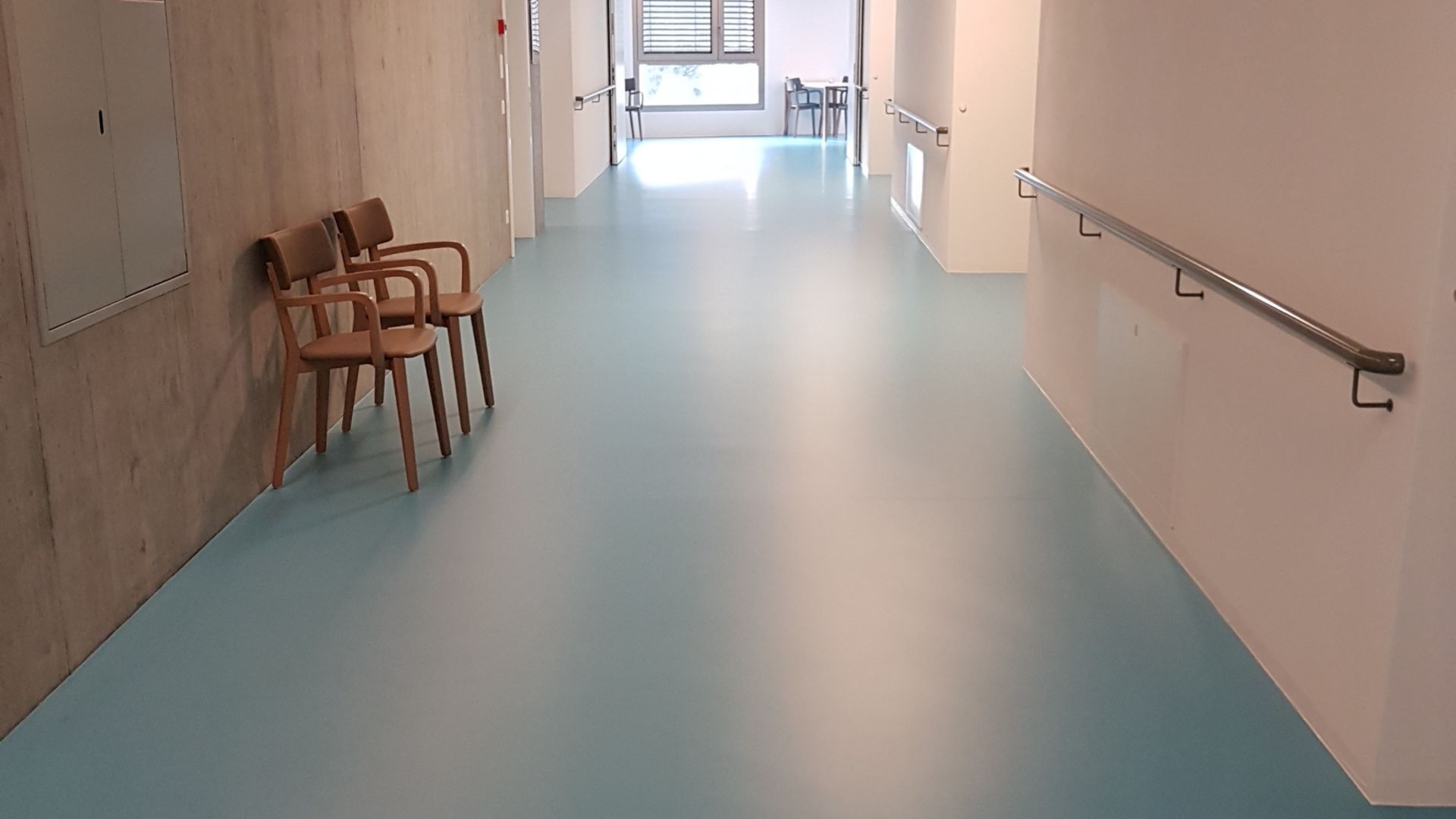 Sika ComfortFloor® blue floor in hospital hallway in Switzerland