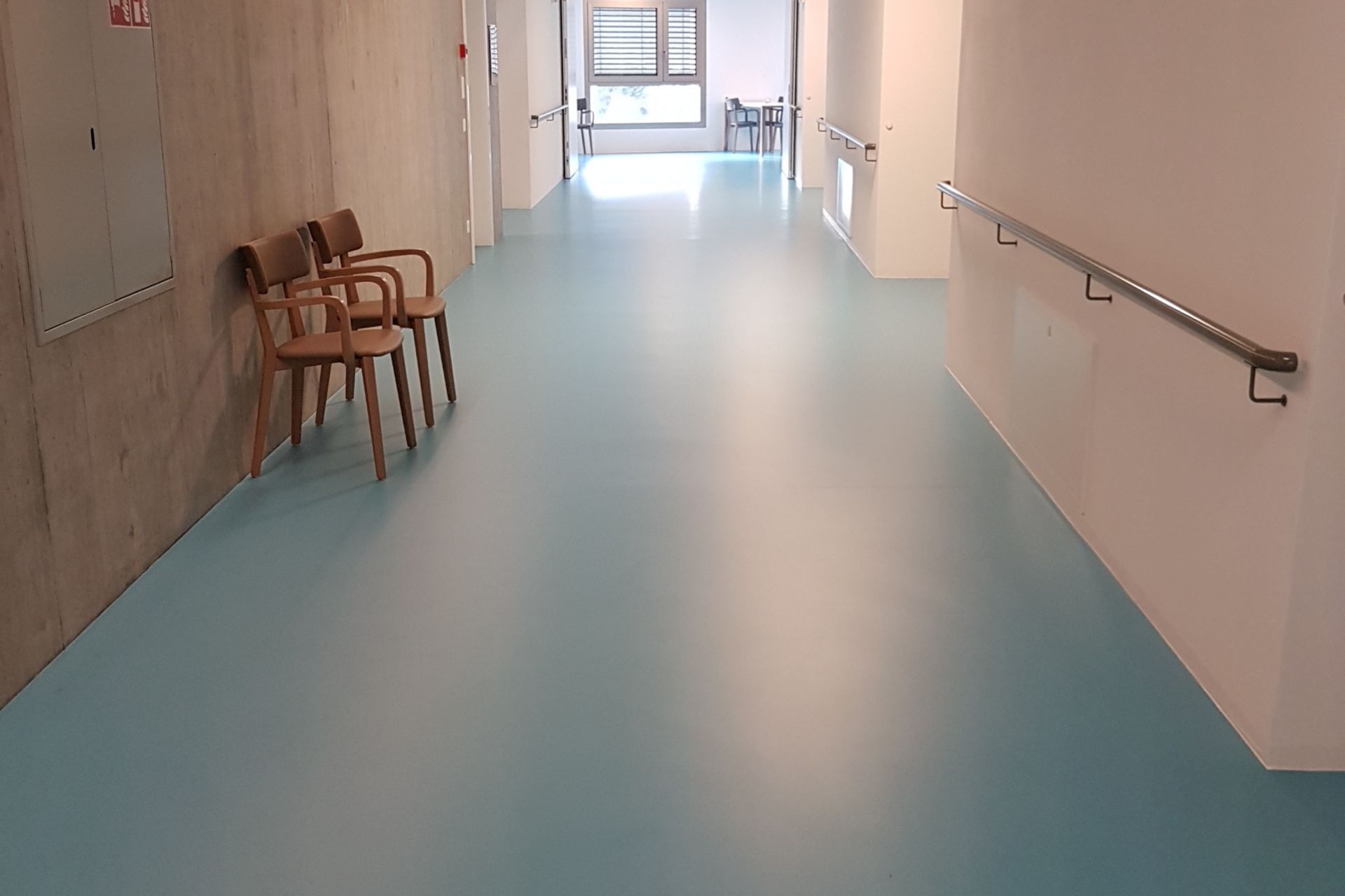 Sika ComfortFloor® blue floor in hospital hallway in Switzerland