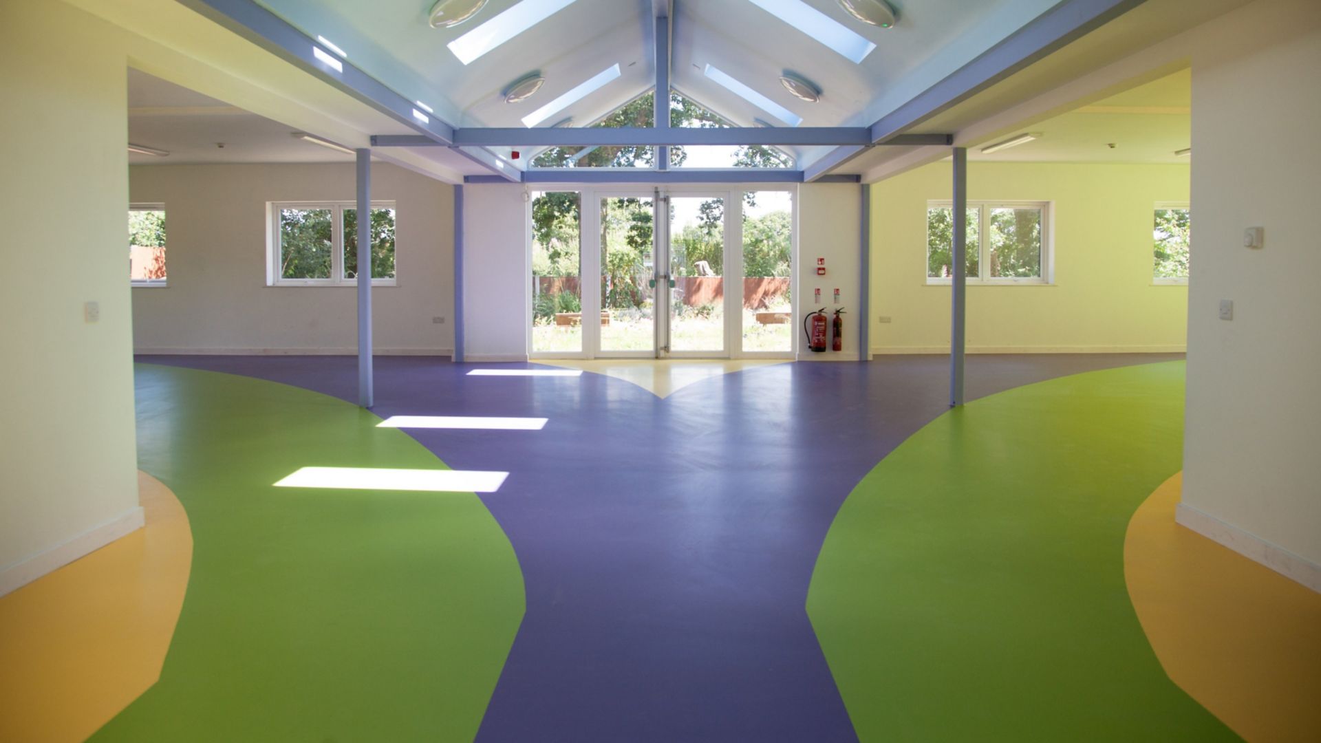 Sika ComfortFloor® blue, green, yellow floor at Rainbow House Charity in UK