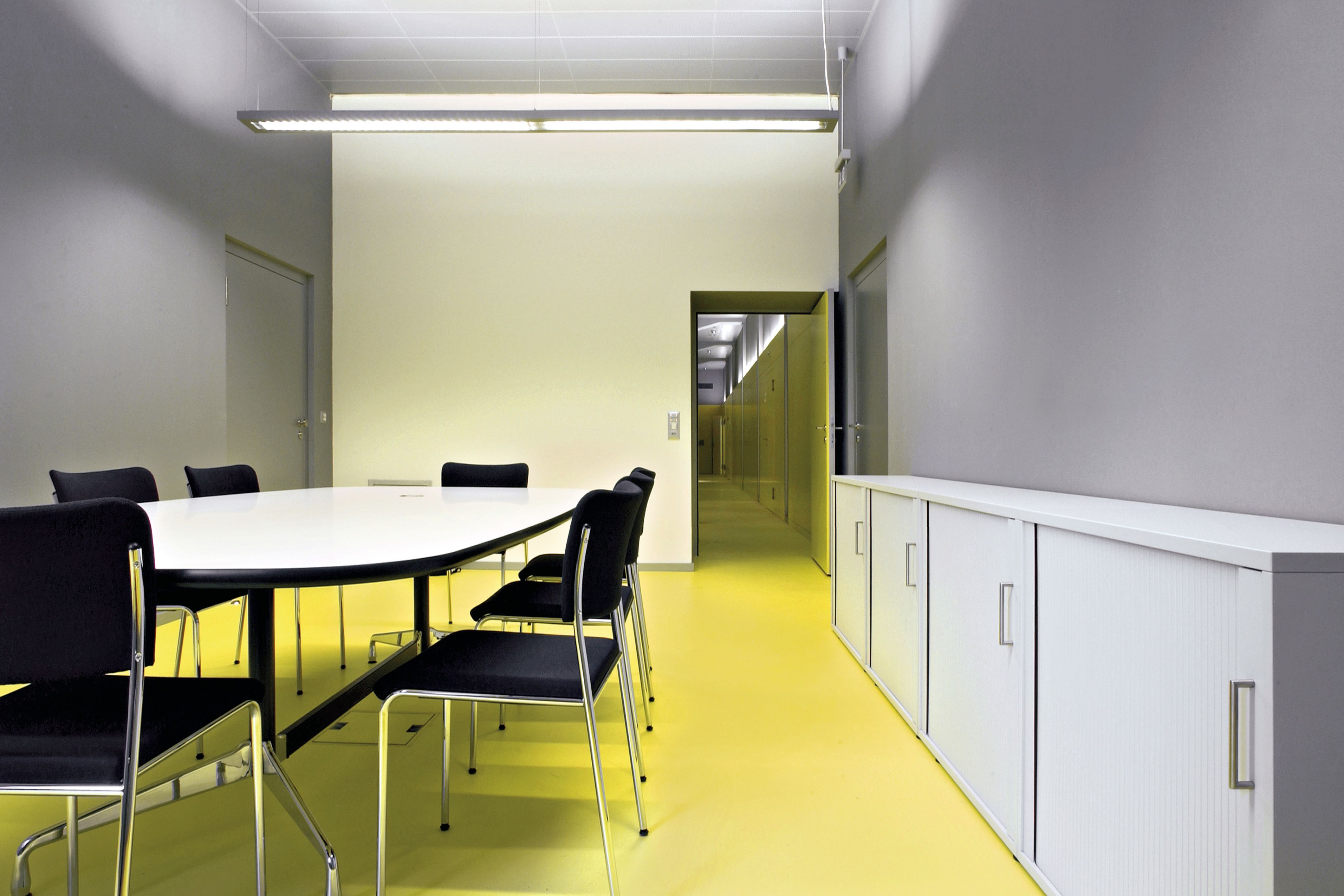 Sika ComfortFloor® yellow floor in office meeting room