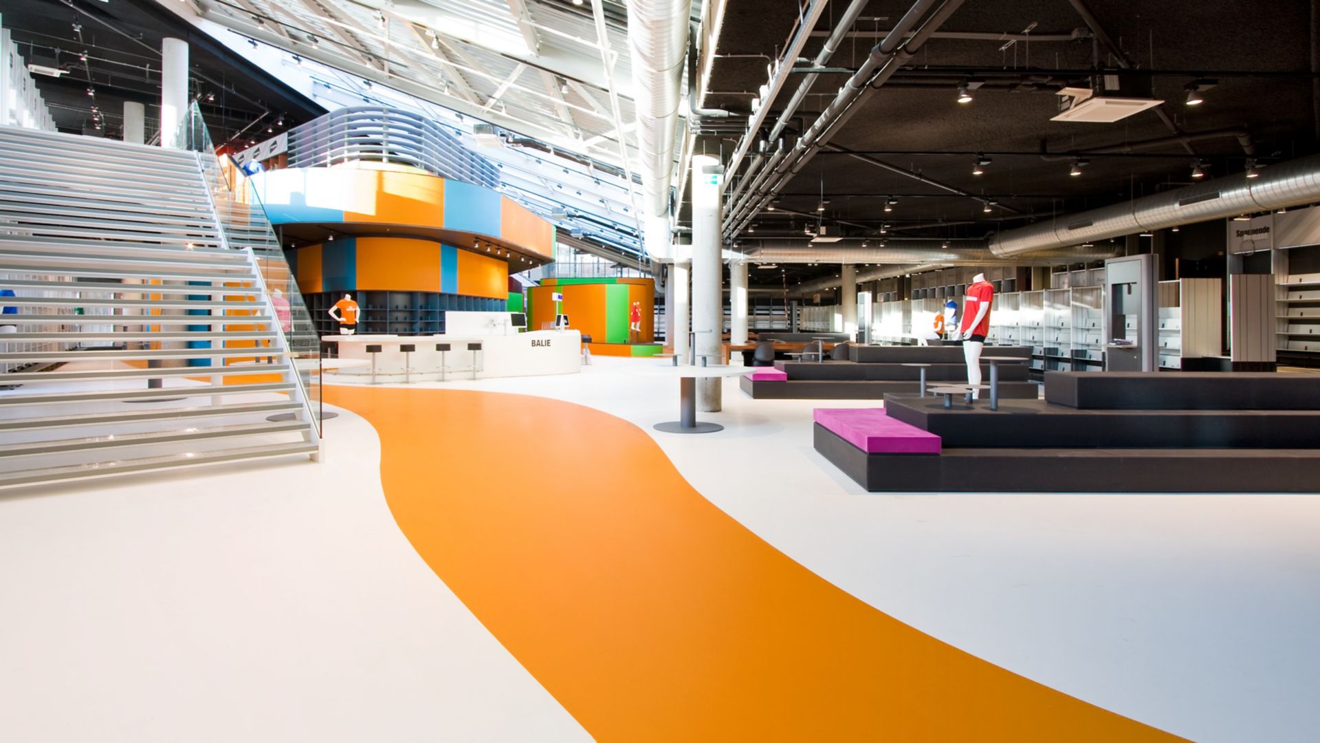 Sika ComfortFloor® orange and white floor in retail shop in Lelystad, Netherlands