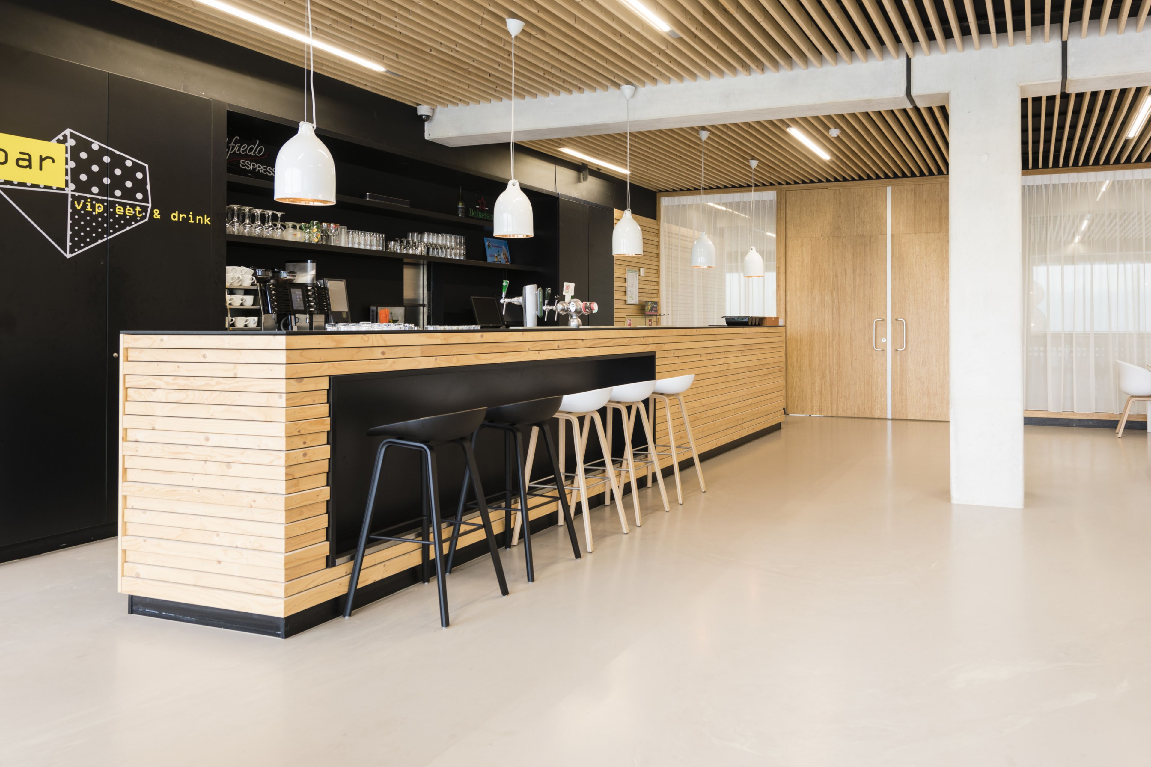 Sika ComfortFloor® beige grey floor in cafe at Sportcomplex Willem Alexander in Hoofddorp, Netherlands
