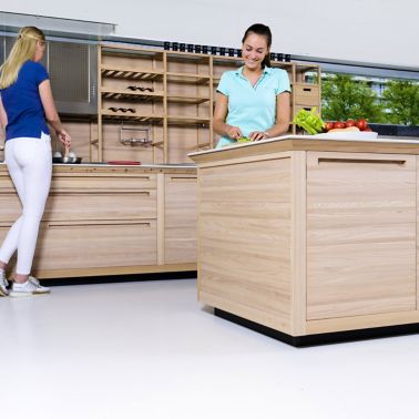 Sika ComfortFloor® white floor in modern kitchen with ladies cooking