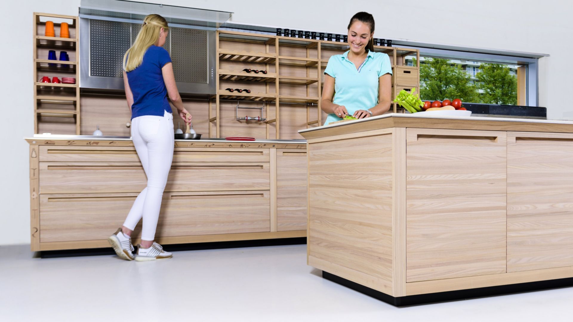 Sika ComfortFloor® white floor in modern kitchen with ladies cooking