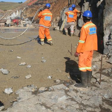 Workers pouring concrete produced with Sika admixtures