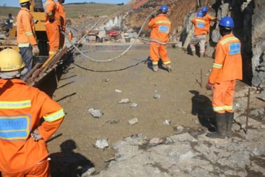 Workers pouring concrete produced with Sika admixtures
