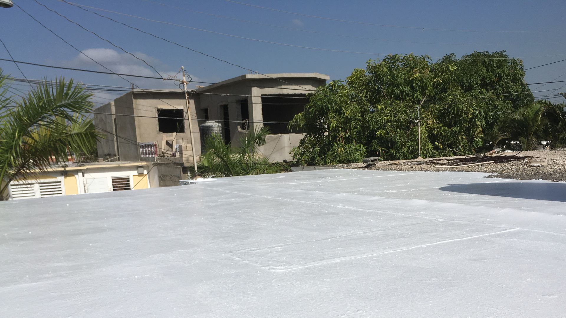 White membrane of cool roof system on residential building