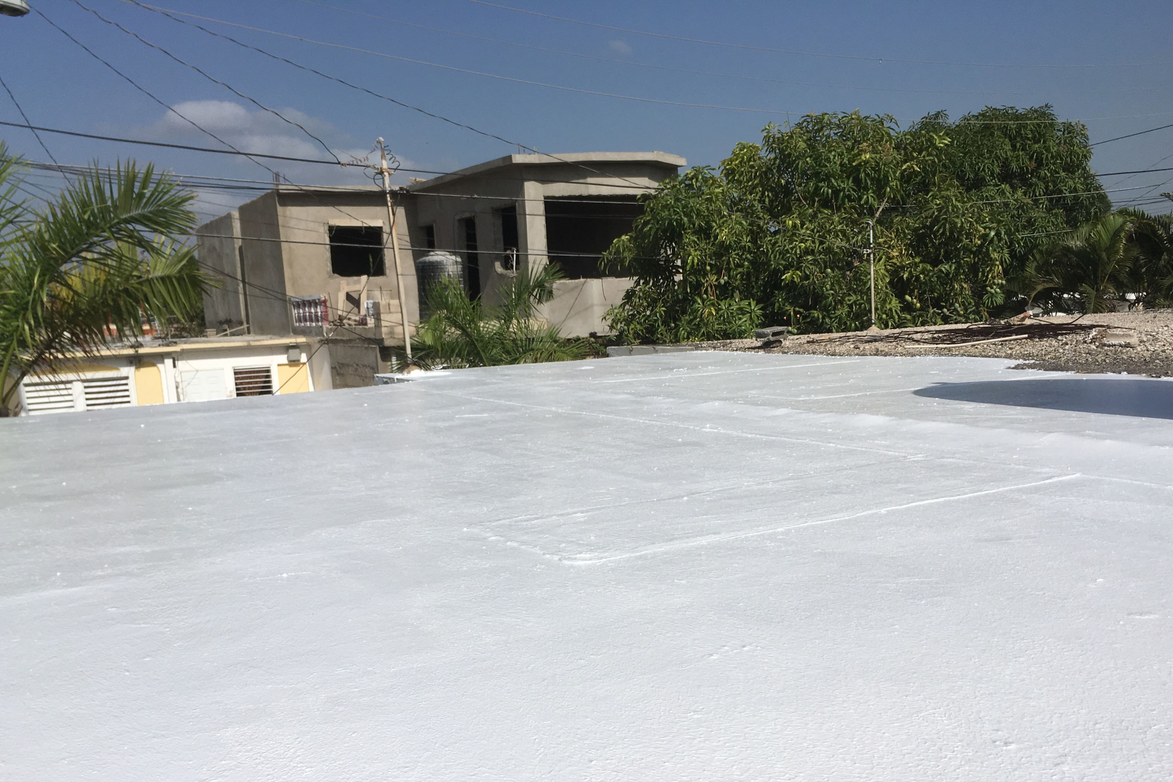 White membrane of cool roof system on residential building