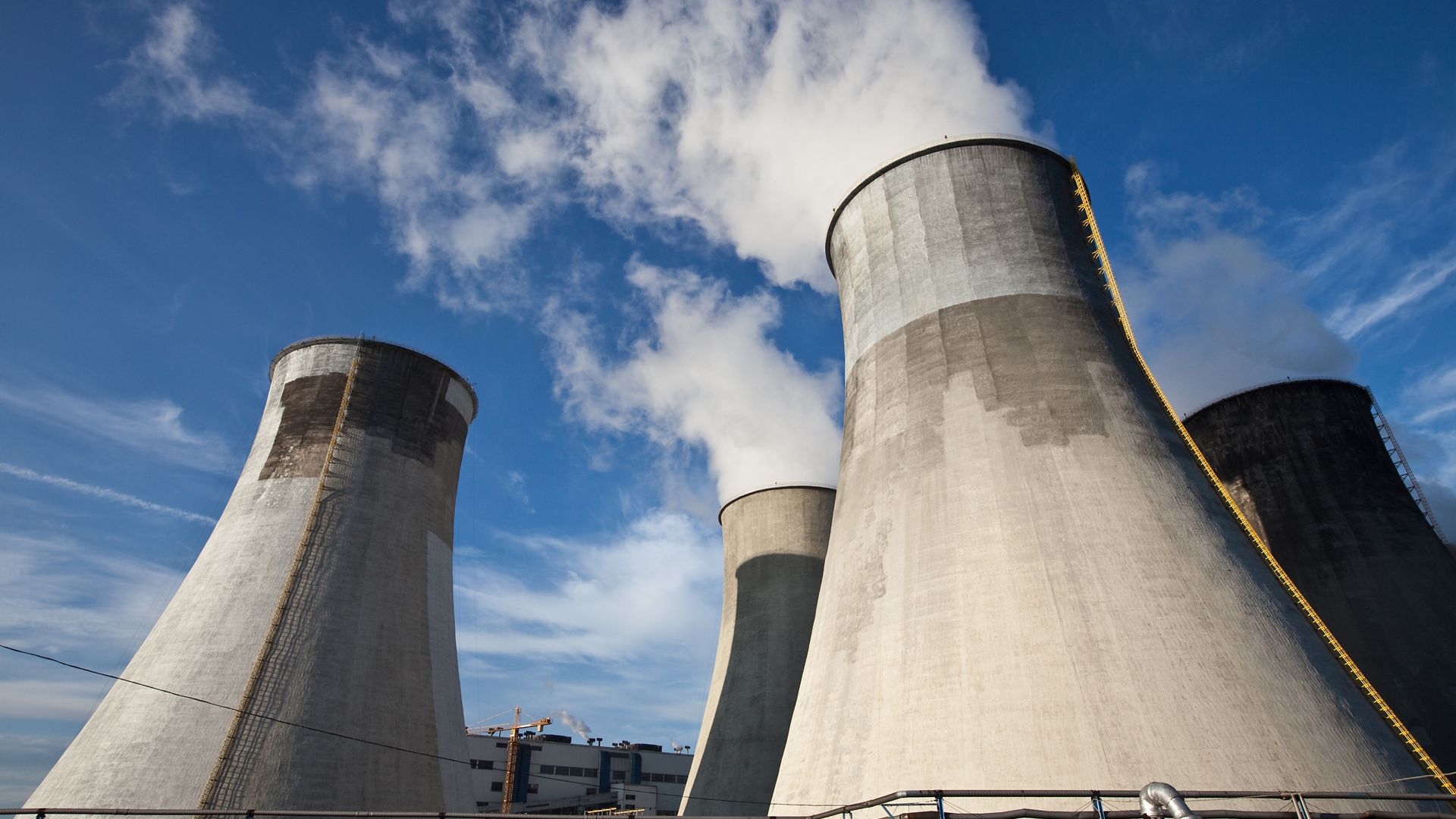 Cooling tower with concrete repair and blue sky