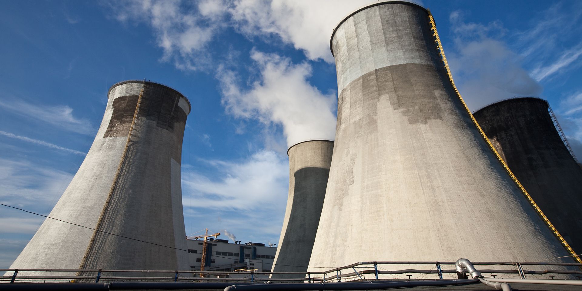 Cooling tower with concrete repair and blue sky
