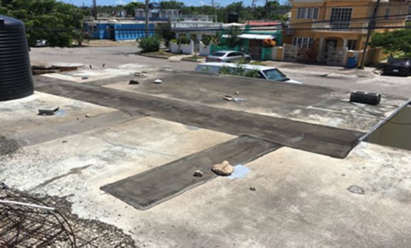 Damaged old roof on residential building