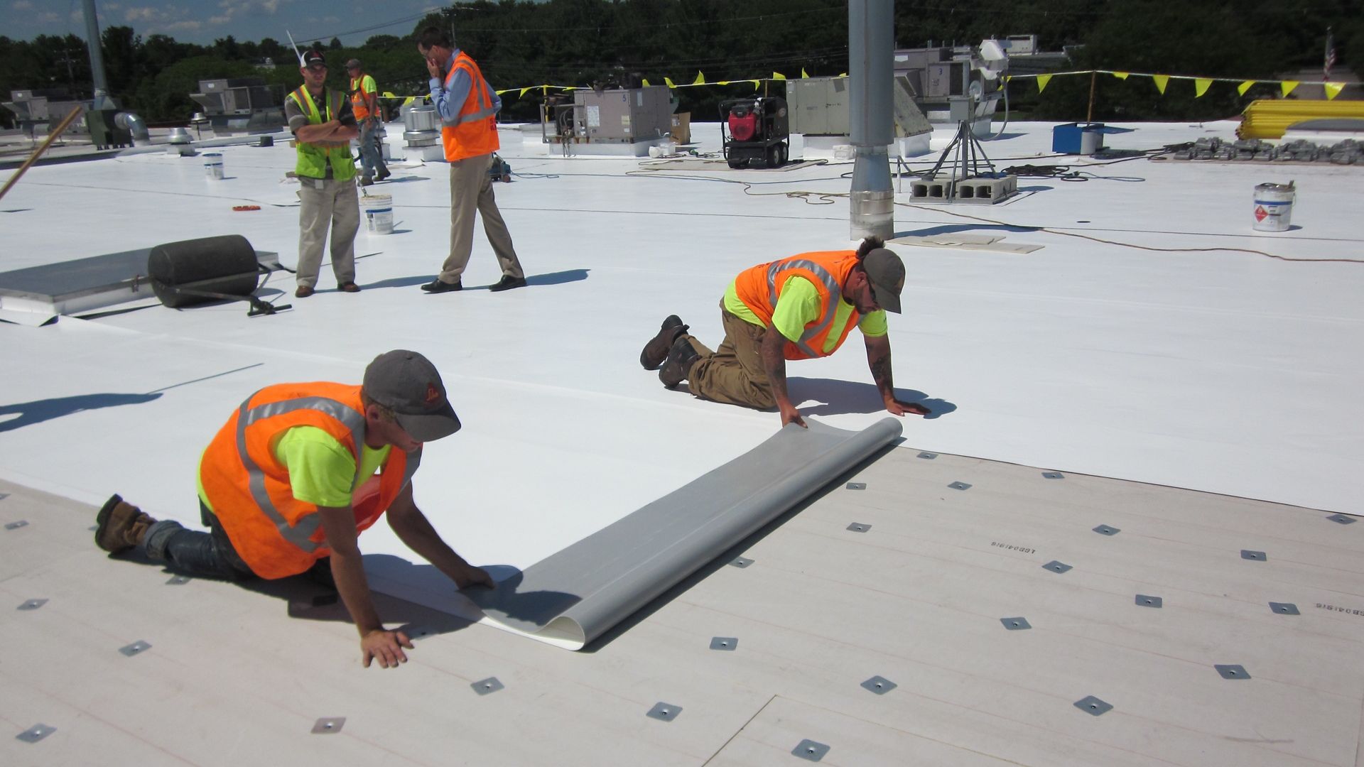 Workers applying Sika Roofing Solutions on a data center