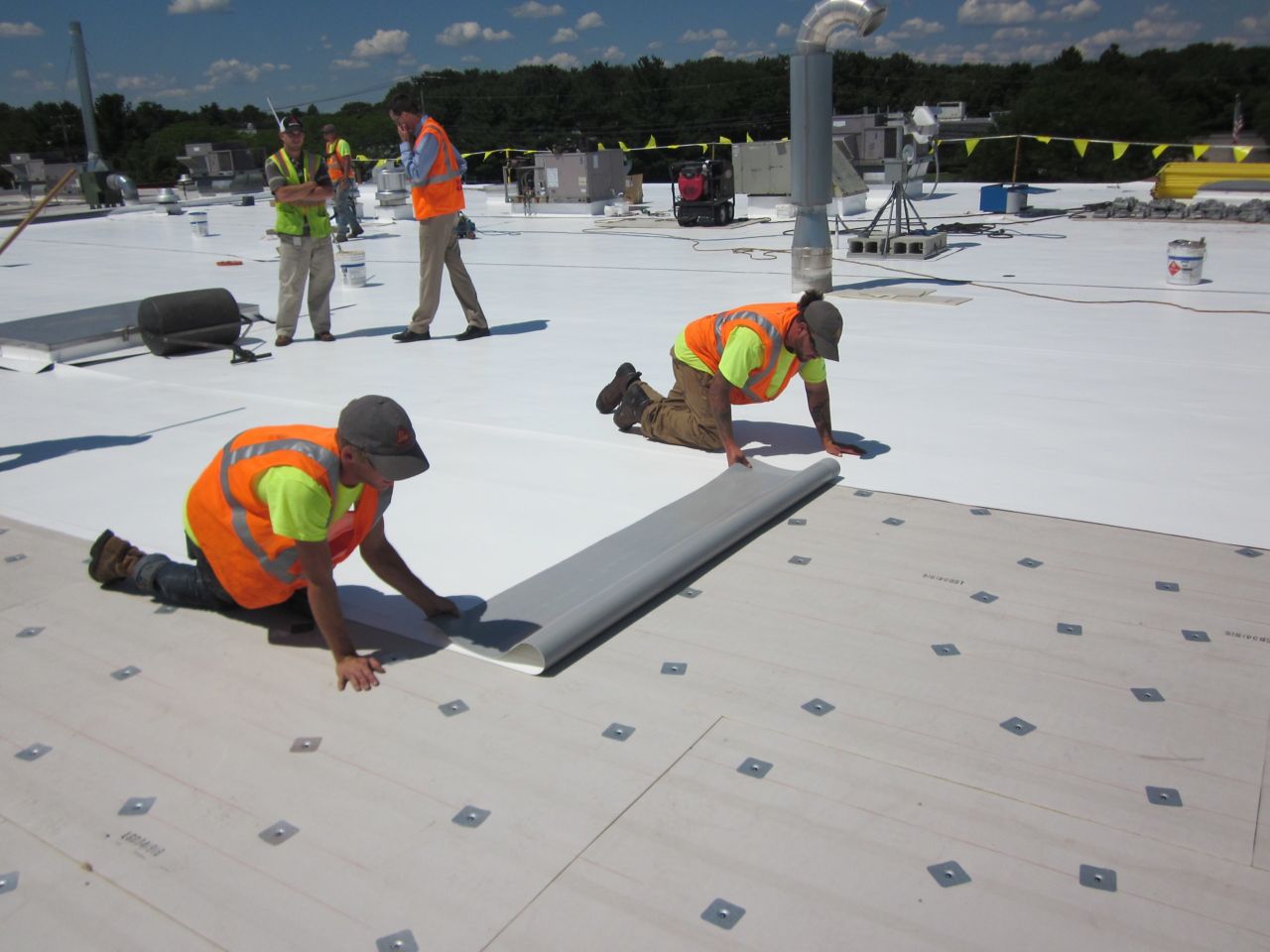 Workers applying Sika Roofing Solutions on a data center
