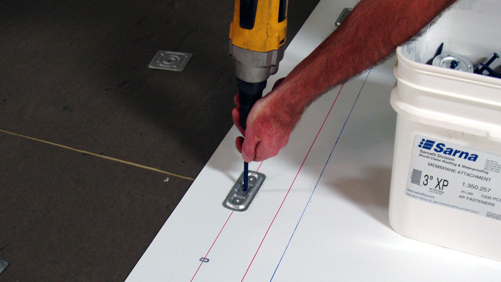 Man applies roofing membrane at a data center 