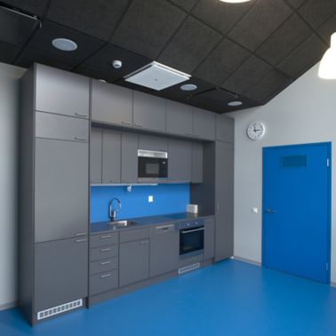 Decorative blue floor grey kitchen at Kokkola campus hall school in Finland with Sika ComfortFloor system