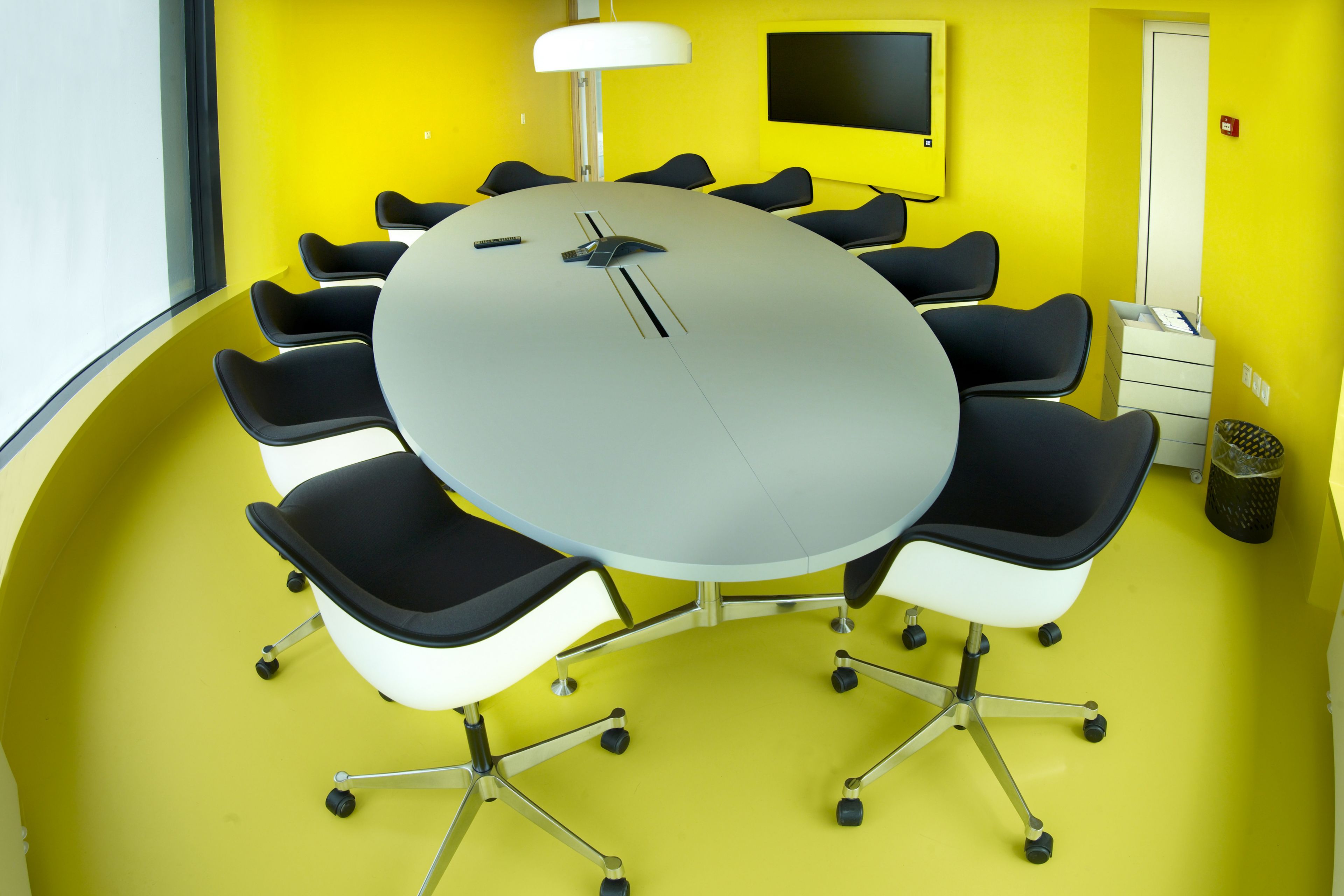 Decorative yellow floor in office meeting room