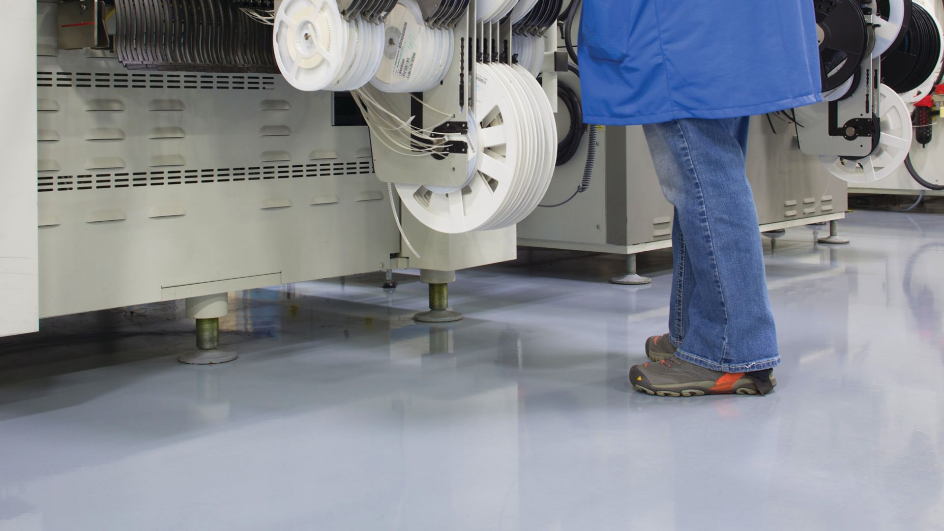 Man standing on industrial floor covered with Sikafloor ESD flooring system