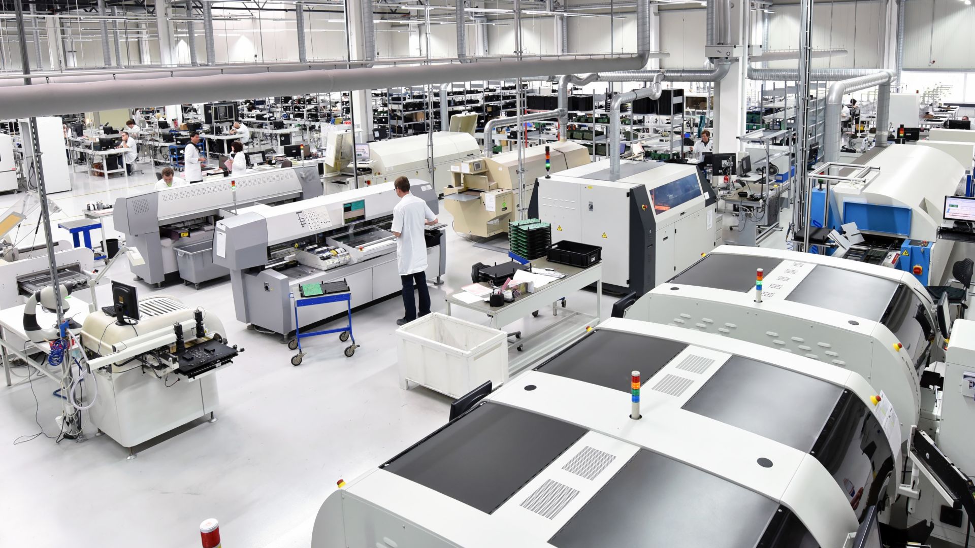 Warehouse with electronic devices, workers and white ESD flooring