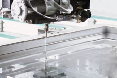 Frame bonding of Windows with an automated adhesive pump system