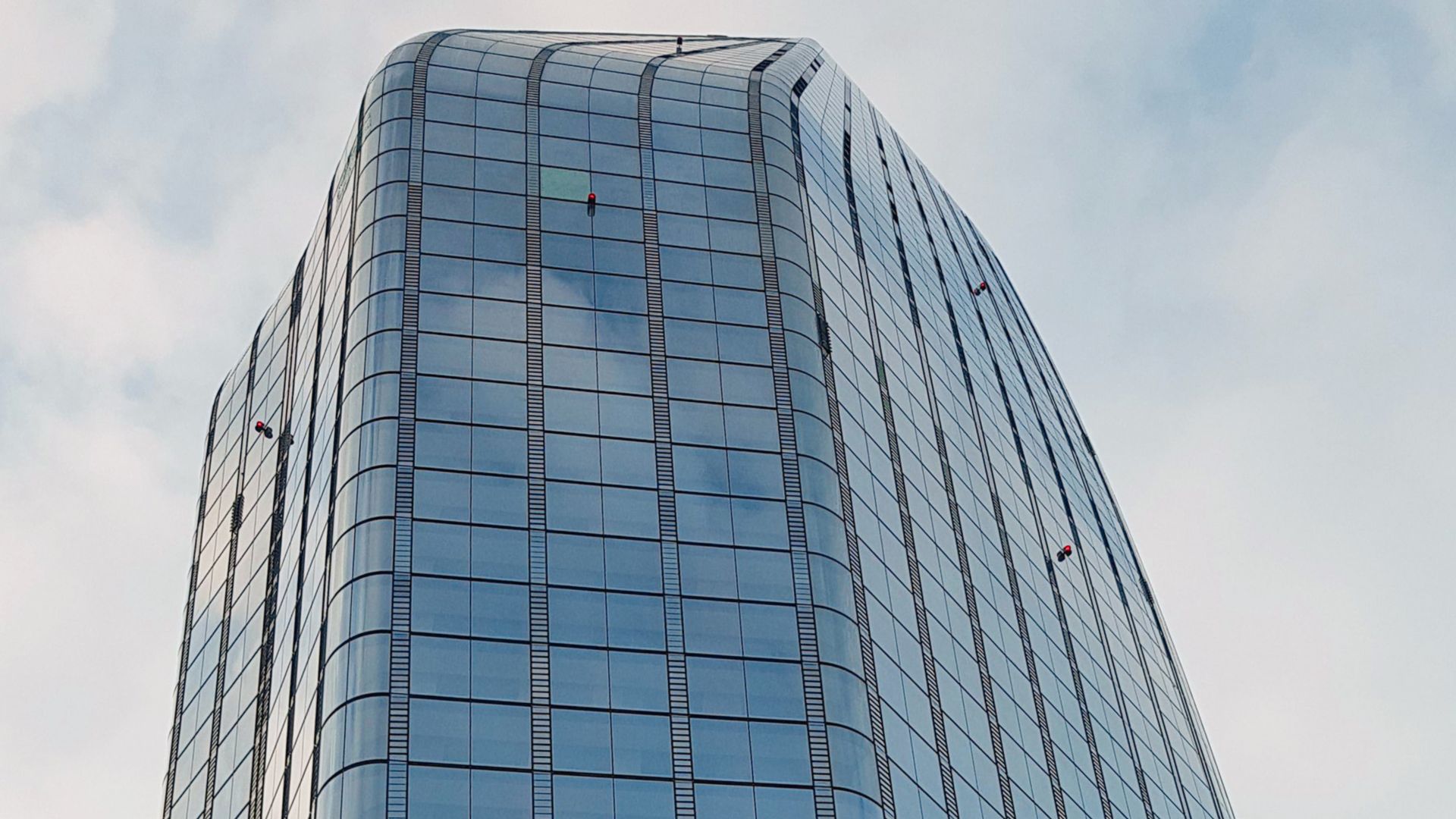 High-rise building with glass facade. Project One Blackfriars.