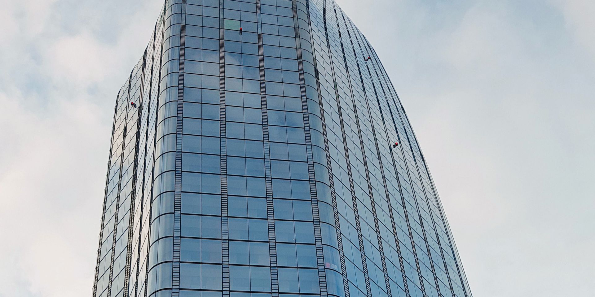 High-rise building with glass facade. Project One Blackfriars.