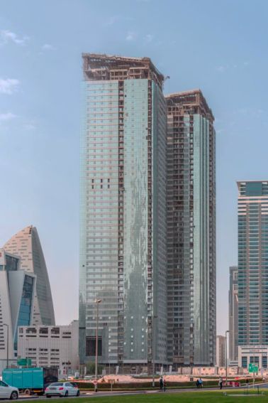 High-rise building with glass facade. Project Tiara United Tower