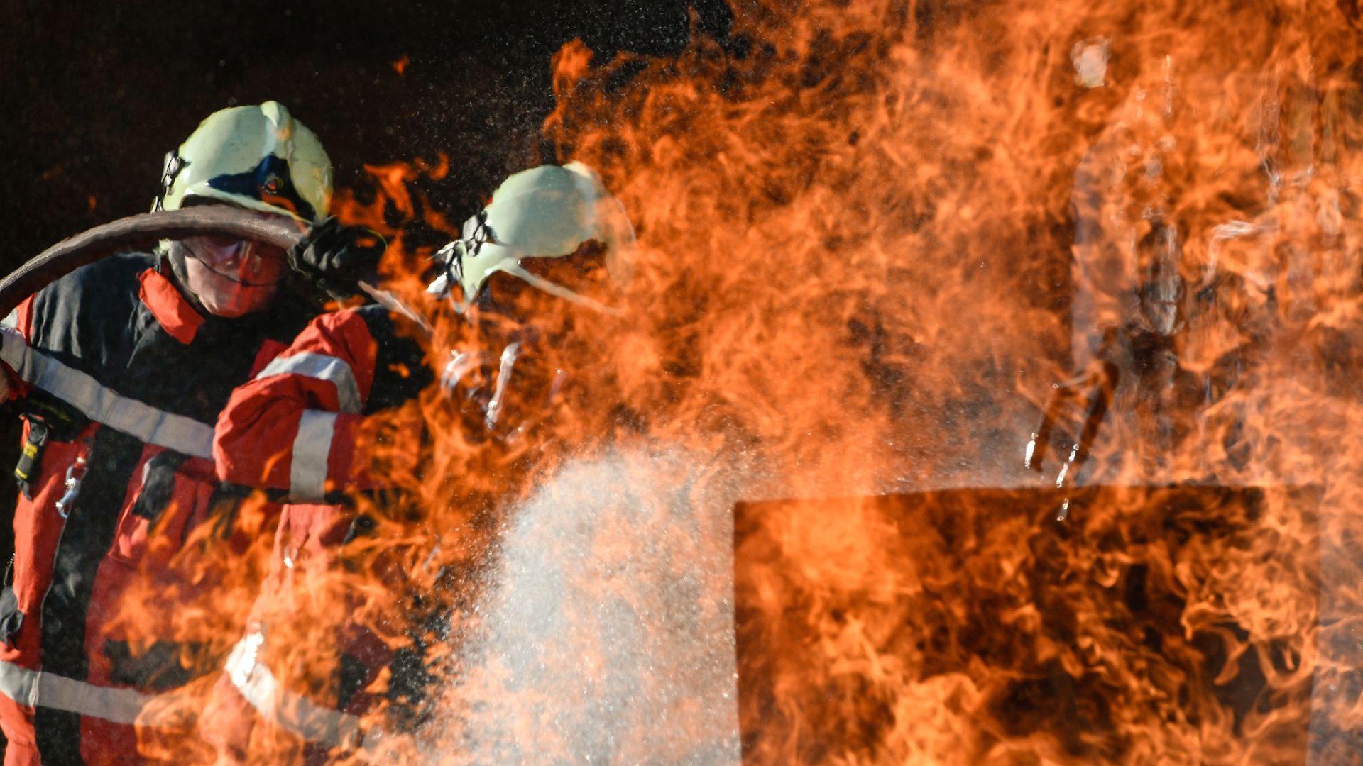 Fireman extinguishing the fire