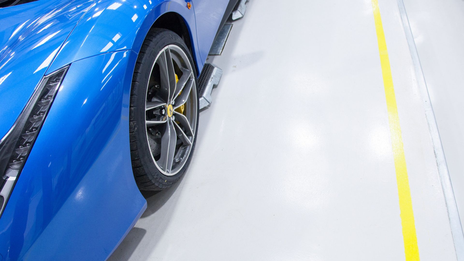 Blue Ferrari car on high gloss Sikafloor surface
