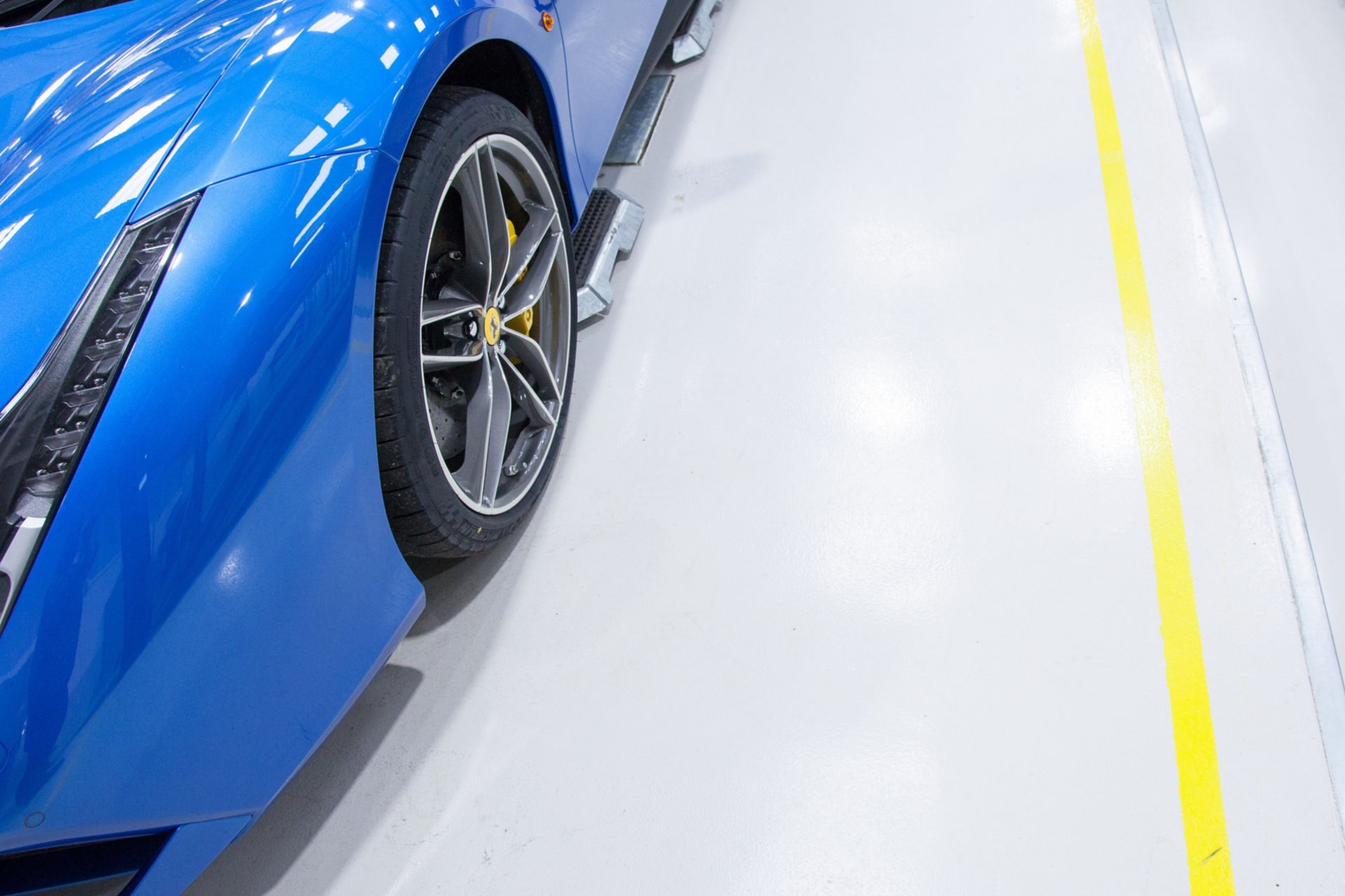 Blue Ferrari car on high gloss Sikafloor surface