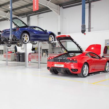 Ferrari cars in repair workshop parked on floor coated with Sika Multidur system